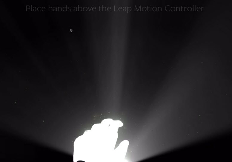 A light-infused hand illuminates darkness. Text onscreen says "Place hands above the Leap Motion Controller".