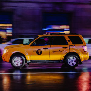 Yellow taxi SUV on the road