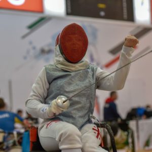 Image of a seated fencer courtesy of International Wheelchair & Amputee Sports Federation (IWASF).