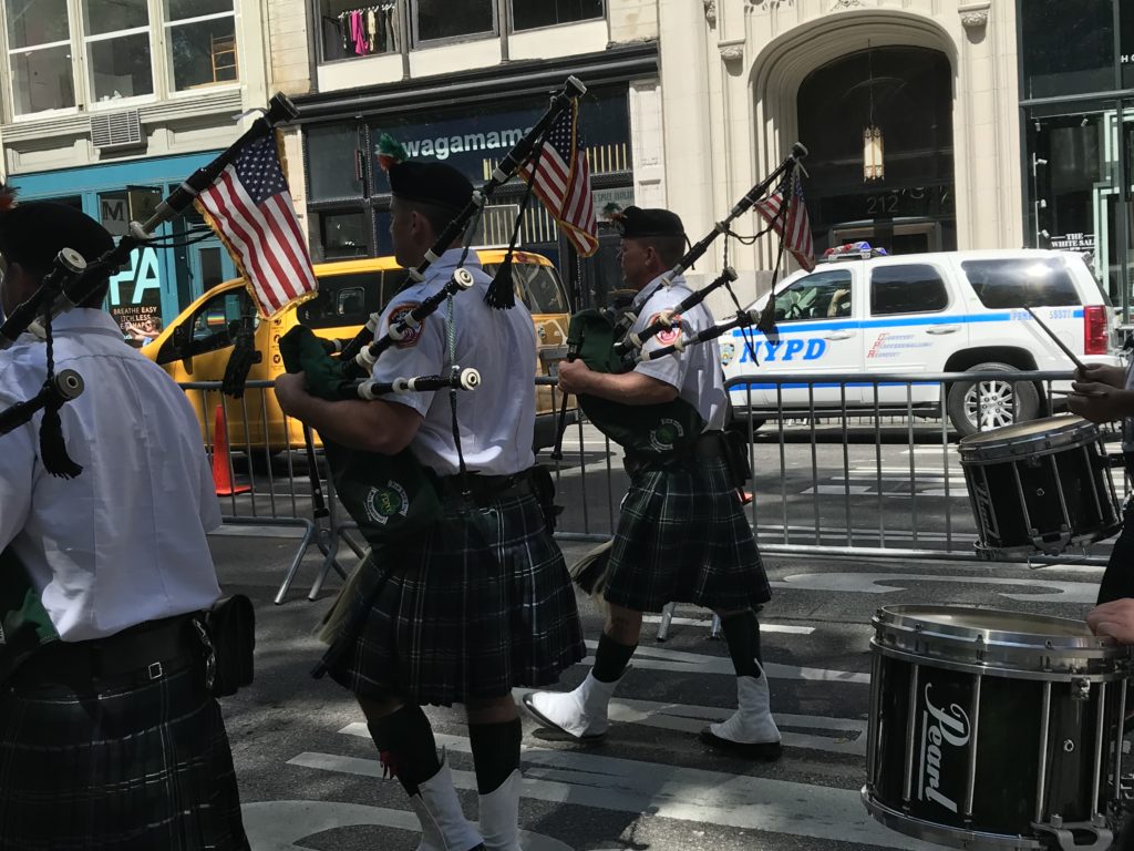 Group of bag pipers marching in the 2019 Disability Pride Parade.
