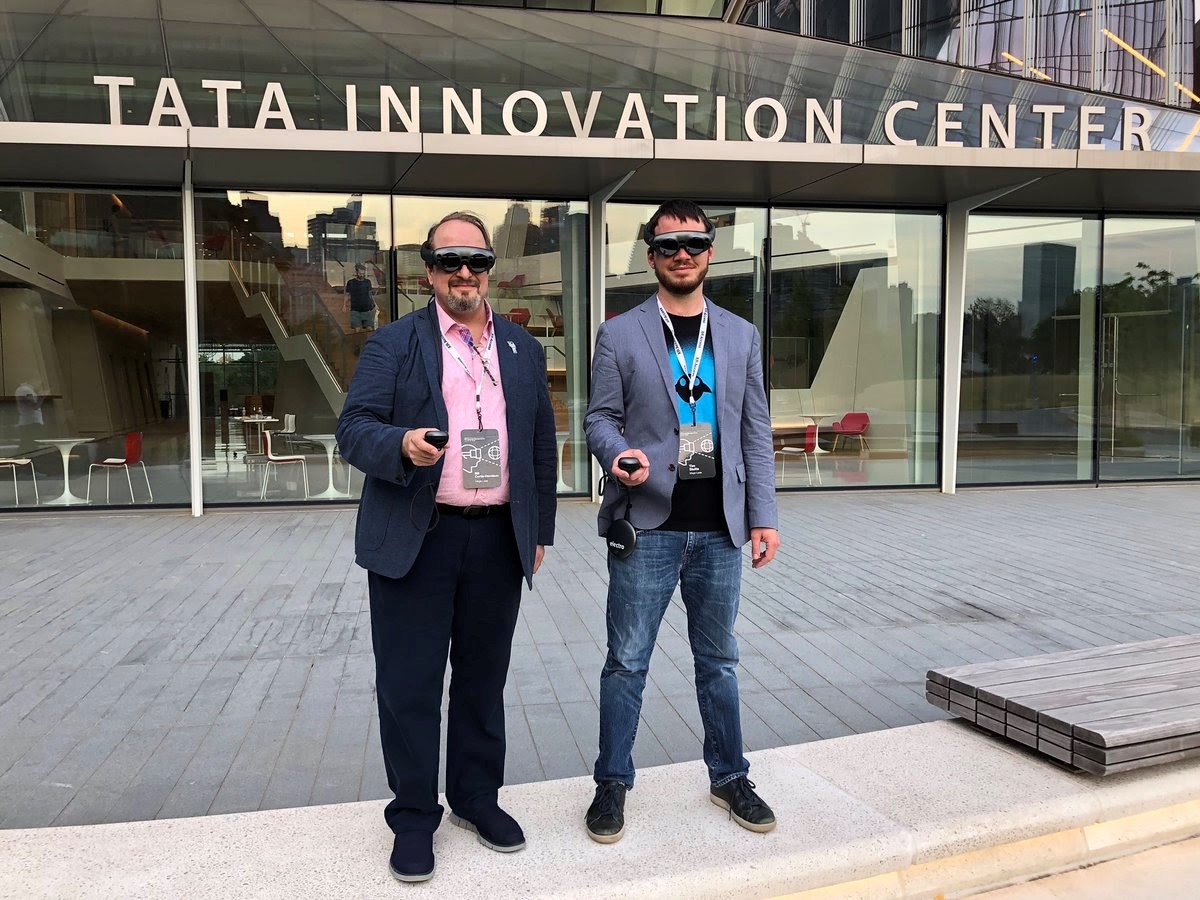 Bill Curtis-Davidson and Tim Stutts (both formerly with Magic Leap) posing outside the Cornell Tech Tata Innovation Center and wearing Magic Leap 1 spatial computing devices during the 2019 XR Access Symposium in New York, July 2019.