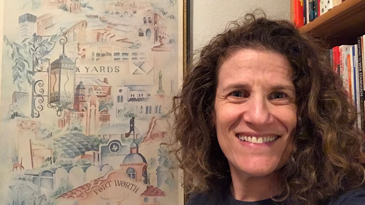 Meryl Evans stands next to an artistic illustration of Forth Worth, Texas