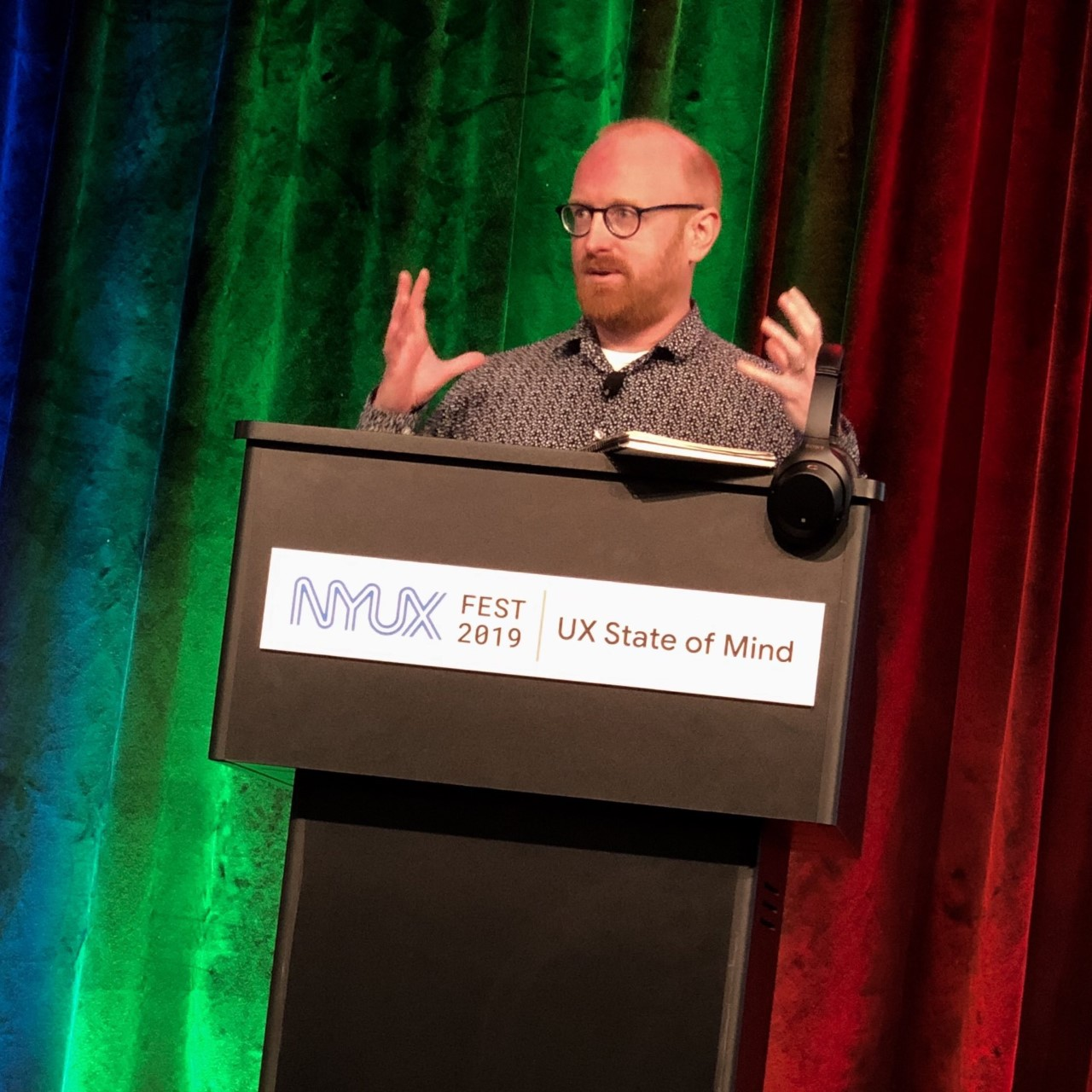 Matt May, Head of Inclusive Design at Adobe standing in front of a podium while presenting at the NYUX Fest 2019.