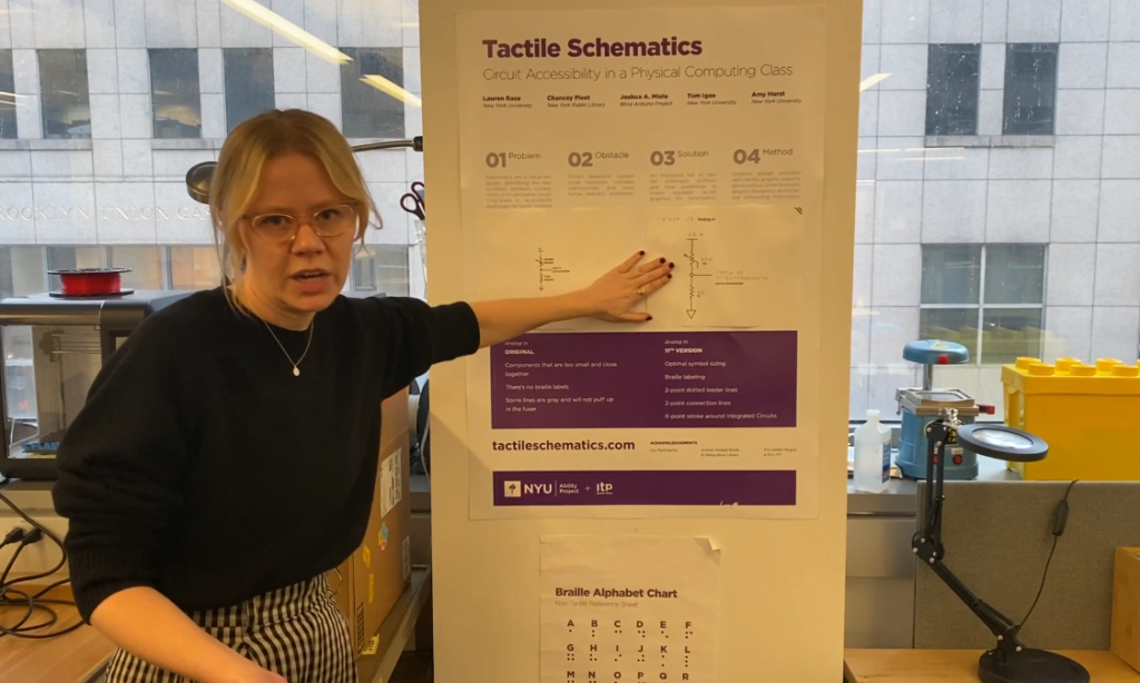 Lauren shows the Tactile Schematics poster with the original and current version of the schematics